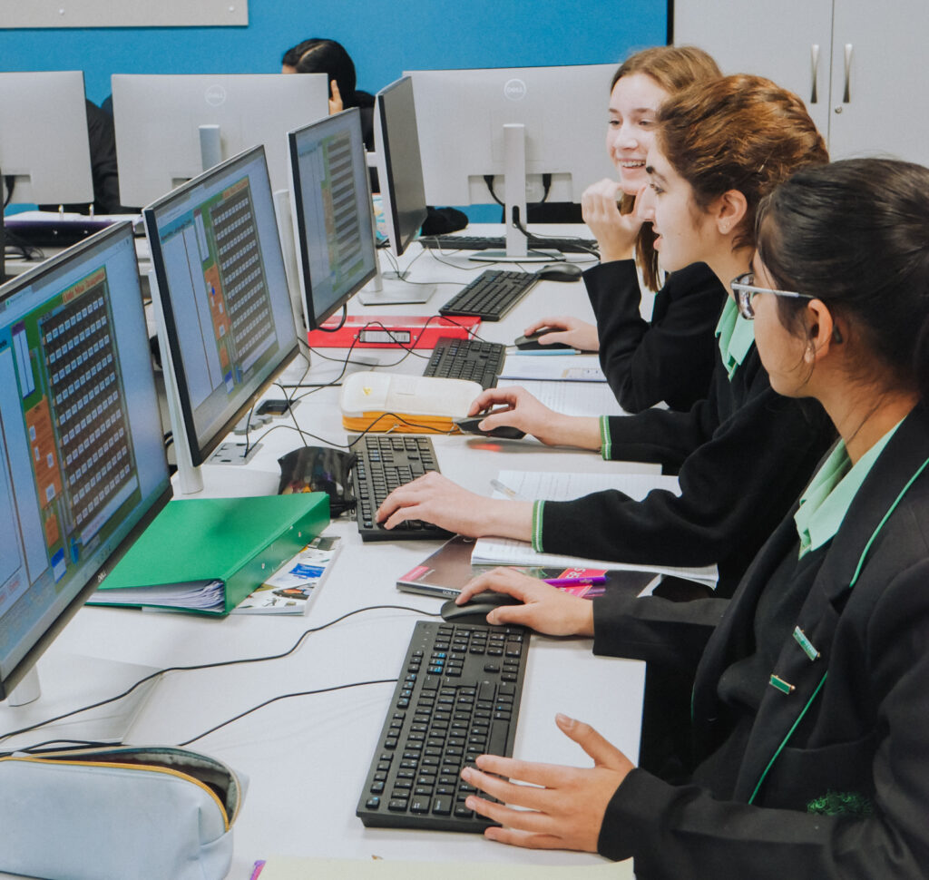a picture of a group of students on computers