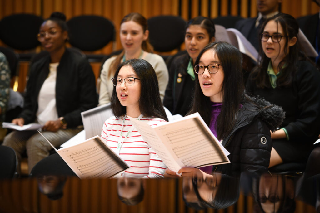 a picture of a group of students singing
