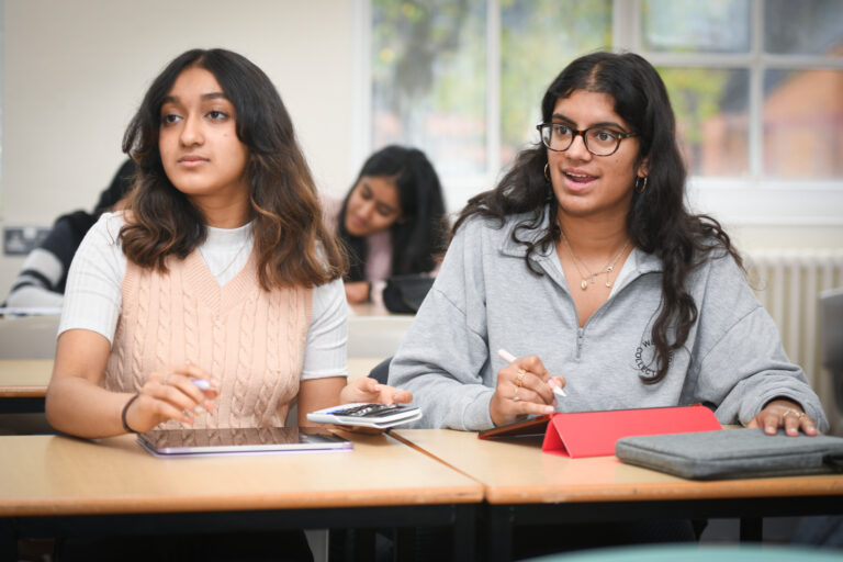 a picture of two students listening in class