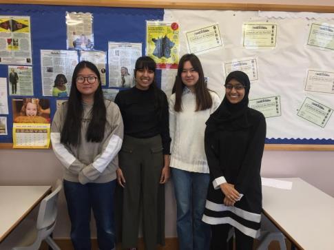 A shot of four students at University of Birmingham Schools Debating Competition