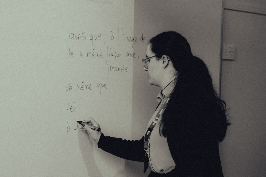 a picture of a language teacher writing on the board