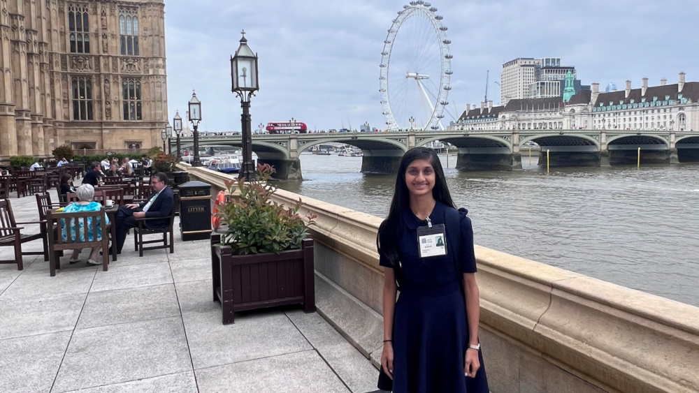 Pupil Anusha standing by the Thames at Westminster